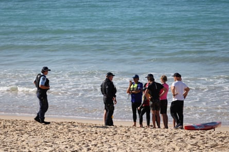 Police speak to people at Coogee beach