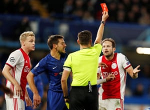 Ajax’s Daley Blind is shown a red card by referee Gianluca Rocchi.