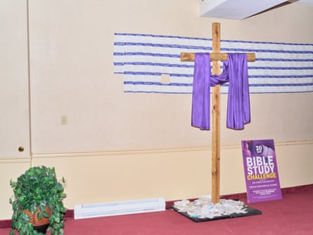 a cross with purple drapery on it
