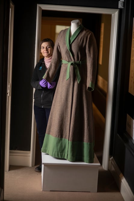 A woman’s dressing gown made after the second world war from a surplus army blanket and repurposed green woollen cloth.