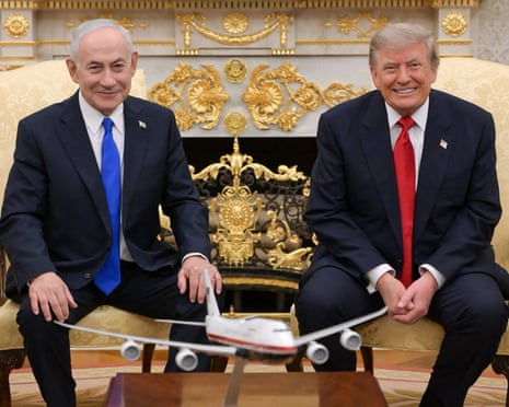 This handout picture released by the Israeli government shows Benjamin Netanyahu posing for a picture with Donald Trump in the oval office of the White House.