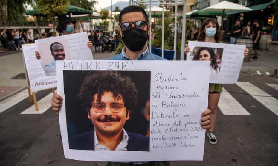 A protester holds up a picture of Patrick Zaki at a demonstration in Naples, Italy.