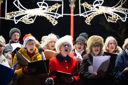 The Encore Singers choir sing during the Christmas carol concert in Borough Gardens, in 2024 in Dorchester, United Kingdom.