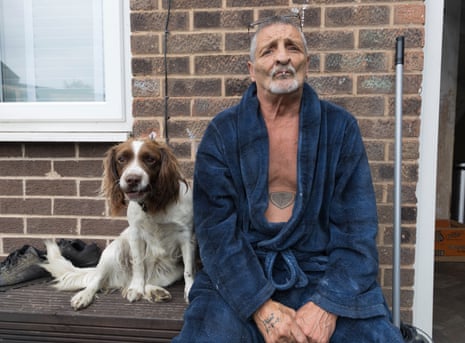 Glyn Guest at home with his dog, who he was walking when he came across the protest