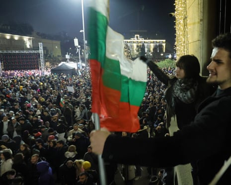 Students wave Bulgarian flag as a swelling crowd of tens of thousands of Bulgarians filled Sofia's central square, demanding the government's resignation amid rising anger over corruption and contested economic policies, Sofia, Bulgaria.