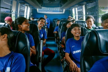 The Bangladesh women’s national football team shares a lighthearted moment on the bus after a morning practice session in August 2025.