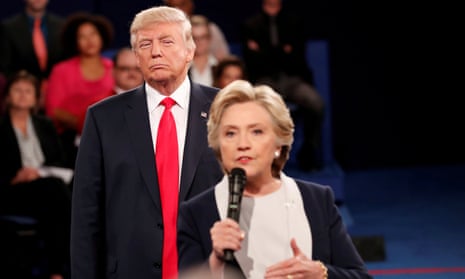 ‘It’s a pressure cooker all the time,’ said Clinton, shown here speaking during a 2016 presidential debate with her opponent, Donald Trump, looming behind her 
