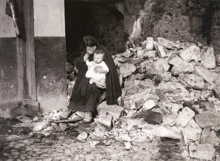 Irish civil war, Dublin, June or July 1922 … a woman sitting amid rubble, with a baby on her lap