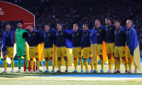 Ukraine players draped in their flag before kick-off against Scotland at Hampden