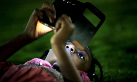 A girl uses her mobile phone in Khartoum, Sudan.