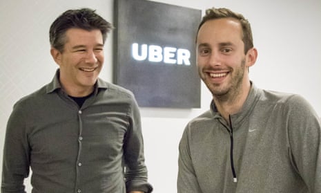 Uber CEO Travis Kalanick (left) and Anthony Levandowski in the lobby of Uber’s headquarters. 