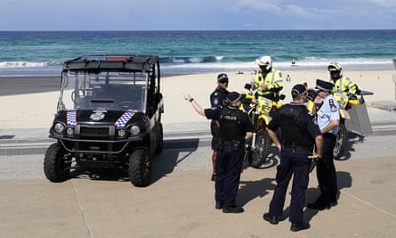 Queensland police gather at Surfers Paradise Beach on the Gold Coast on Thursday.
