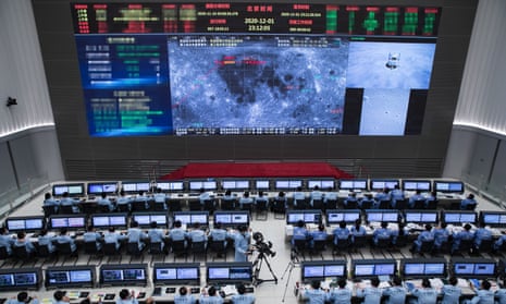 Technical personnel work at the Beijing Aerospace Control Center (BACC) on 1 December 2020, as China successfully lands the Chang’e-5 probe on the moon. 