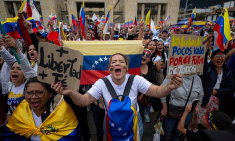 Demonstrators shout slogans during a protest against Venezuelan President Nicolas Maduro's disputed victory in the presidential elections on July 28 at Bolivar Square in Bogota