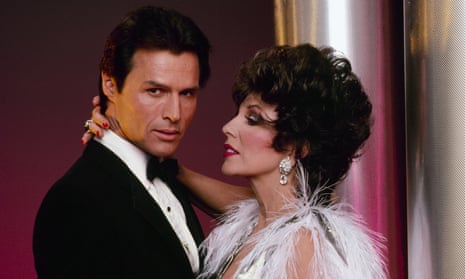 Michael Nader with Joan Collins in a scene from Dynasty, 1985. 