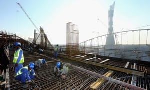 Construction workers on Khalifa International Stadium, in Doha, Qatar