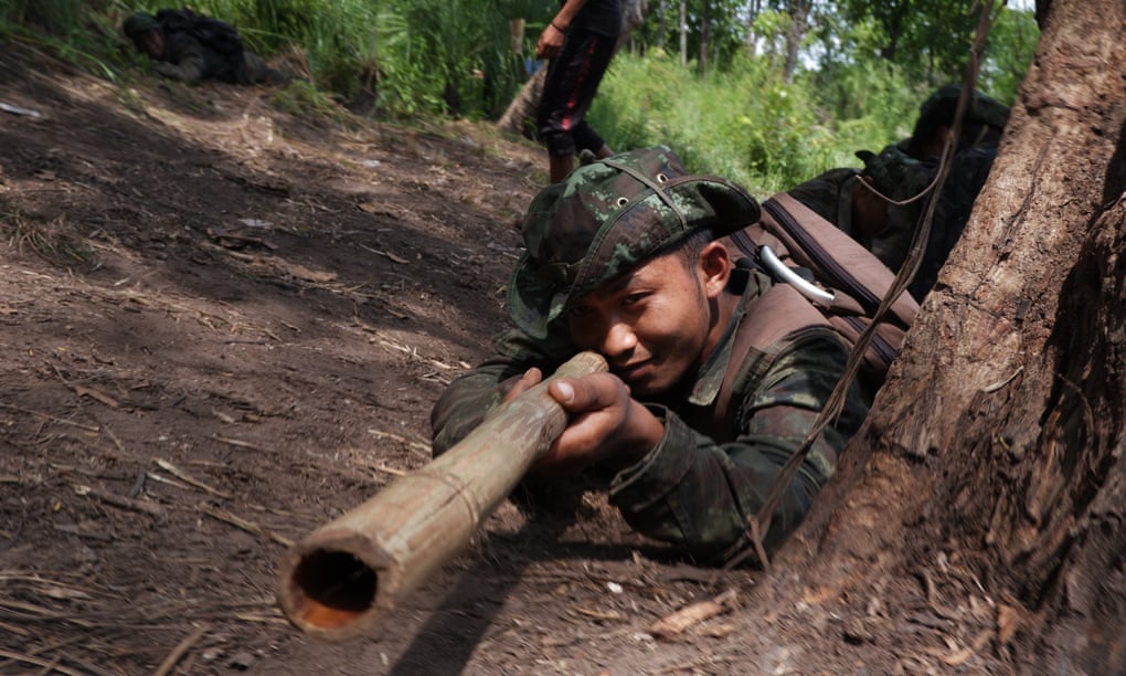 A pro-democracy fighter trains with a fake gun in Myanmar: The Forgotten Revolution
