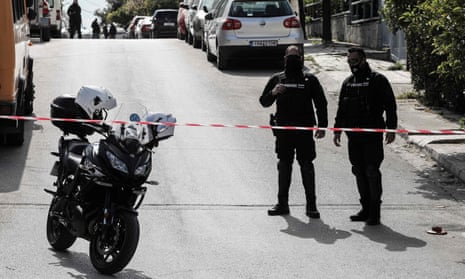 Police block the road in a southern suburb of Athens where journalist Giorgos Karaivaz was shot on 9 April. 