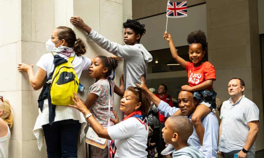 Beverly and Noel Chung's grandchildren (who are below) watch the parade and events at St. Paul's. The Chungs are a second and third generation family from the Caribbean. People and crowds gather at the Queen's Jubilee Service of Thanksgiving at St Paul's Cathedral in London.