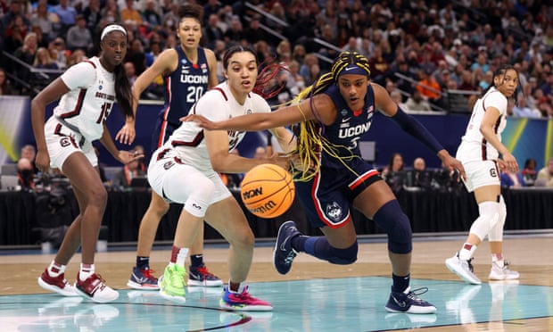 The UConn Huskies and South Carolina Gamecocks compete for the ball in the final of the NCAA women’s tournament