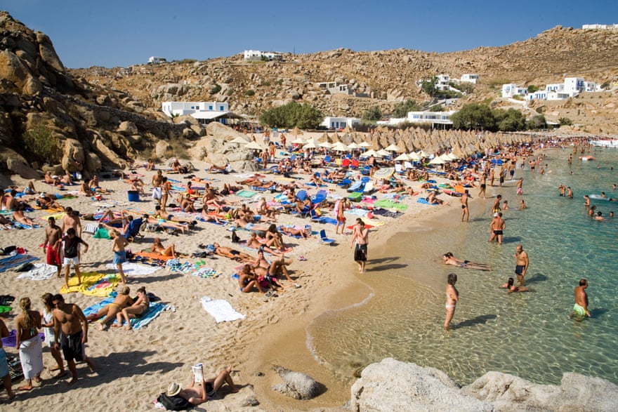 People bathing at Super Paradise Beach, Mykonos, Greece