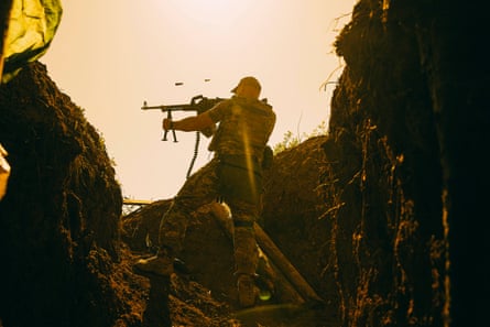 Bringing you closer to war … a machine-gunner firing on infantry positions in the Donetsk region.