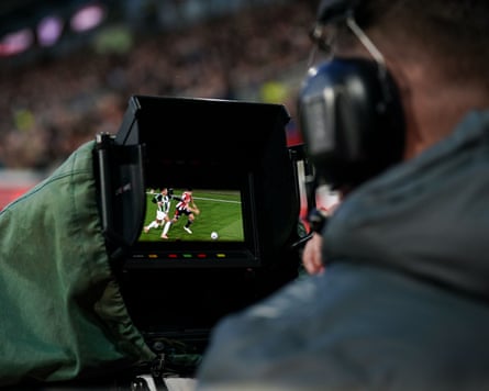 Camera operator at a football match