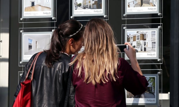 Women looking at property adverts