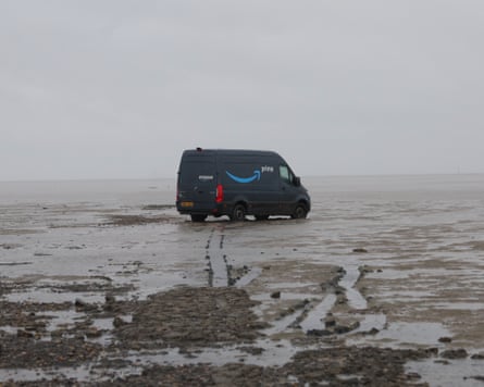 An Amazon van stranded in the Thames estuary at Foulness, Essex