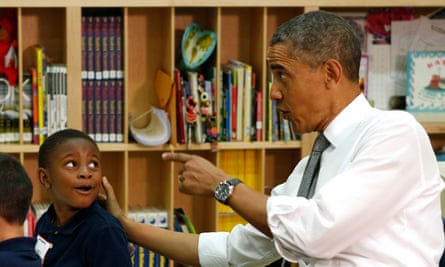 Barack Obama in a school with a young boy