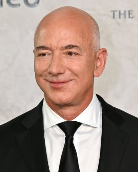 Head and shoulders photo of Jeff Bezos in black suit and tie