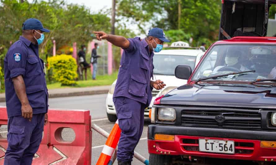 Security officers man a checkpoint at a junction in Suva on April 27, 2021, after the Fijian capital entered a 14-day lockdown.