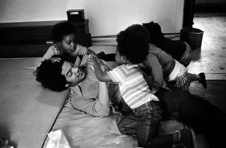 Film-maker and Black Panther Austin Allen wrestles with Panther children at the Intercommunal Youth Institute in 1972.