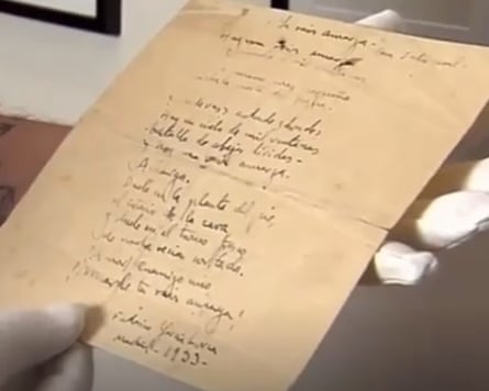 A person holds the Lorca verse.