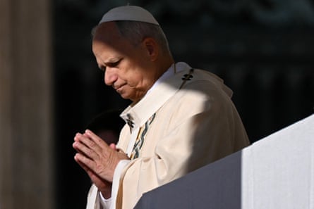 Pope with hands held in prayer.
