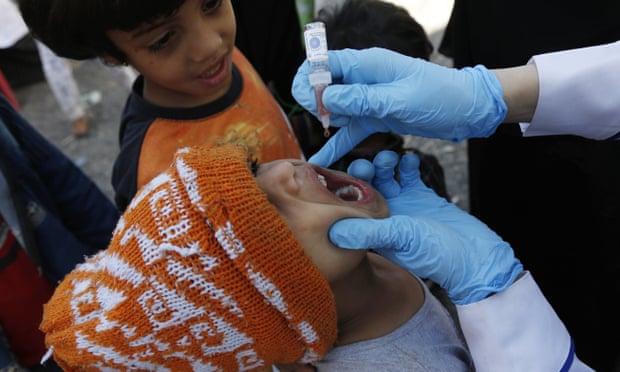 Children receive vaccines against measles and polio in Sana’a, Yemen.