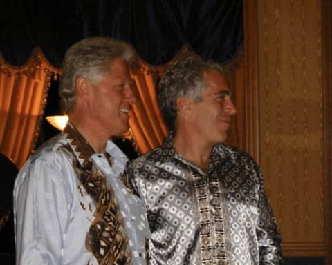 two men stand together smiling