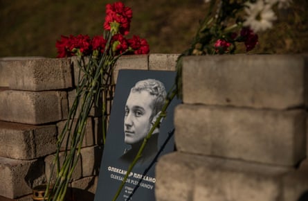 A memorial to Oleksandr Plekhanov, with flowers beside it