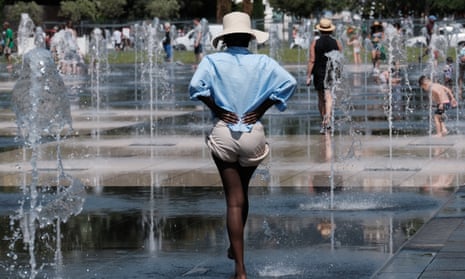 People cool off under fountains in Nice, France