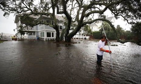 Carolinas’ Coast Line Recovers From Hurricane Florence, As Storm Continues To Pour Heavy Rain On The States<br>WILMINGTON, NC - SEPTEMBER 15: Mike Pollack searches for a drain in the yard of his flooded waterfront home a day after Hurricane Florence hit the area, on September 15, 2018 in Wilmington, North Carolina. Hurricane Florence made landfall in North Carolina as a Category 1 storm Friday and at least five deaths have been attributed to the storm, which continues to produce heavy rain and strong winds extending out nearly 200 miles. (Photo by Mark Wilson/Getty Images)