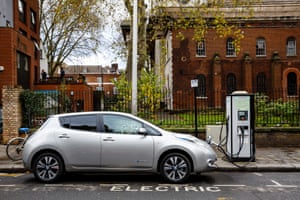 A Nissan Leaf using a street charger.