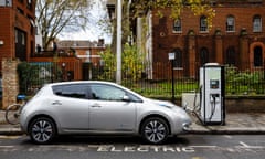 Go Ultra Low Electric Vehicle on charge on a London street<br>Go Ultra Low Nissan LEAF on charge on a London street. Ultra-low emission vehicles such as this can cost as little as 2p per mile to run and some electric cars and vans have a range of up to 700 miles.