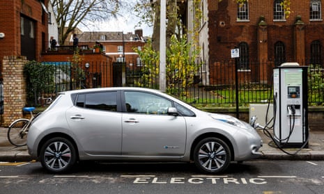 An electric car charging on a London street.