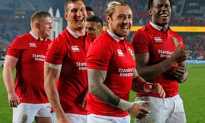 The Lions team celebrates after holding the All Blacks to a draw at Eden Park on Saturday.