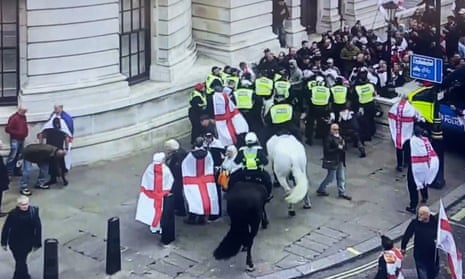 Police arrest several men as clashes break out at St George’s Day rally in London – video