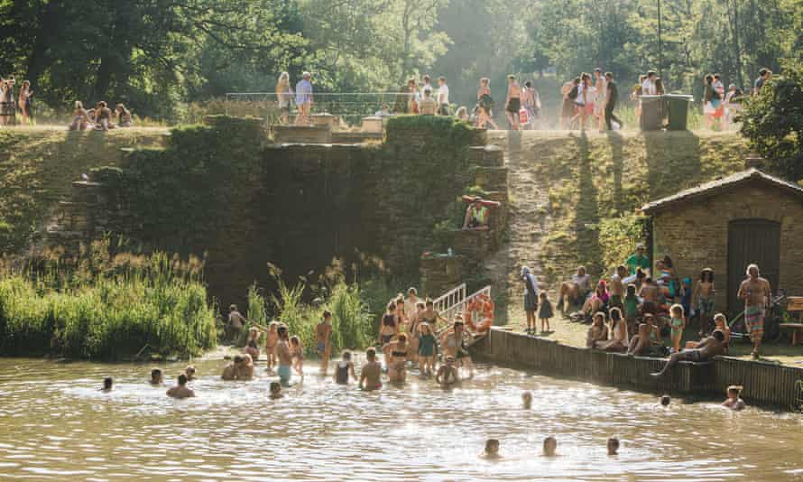 people swimming at wilderness festival in oxfordshire
