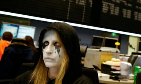 A share trader dressed in a Shrove Tuesday carnival costumes at the Frankfurt stock market today.