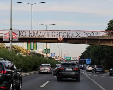 A banner reading “Ratko Mladic, Serbian Hero” is displayed on a footbridge over a motorway as a convoy carrying the body of Bosnian Serb war criminal Ratko Mladic passes through Belgrade, Serbia.