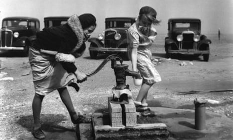Children pump water in Colorado, in 1935, the year the term ‘greenhouse effect’ was first used in the Observer