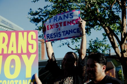 a group of people holding signs
